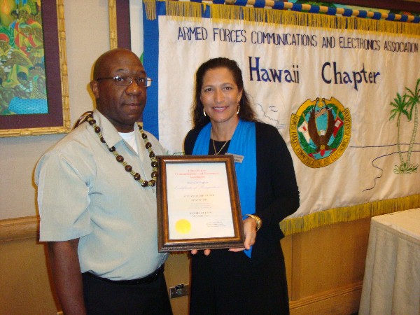 Pacheco presents the August AFCEAN of the Month Award to Chief Warrant Officer Danzie Ruffin, USN (Ret.), Naval Computer and Telecommunications Area Master Station Pacific.